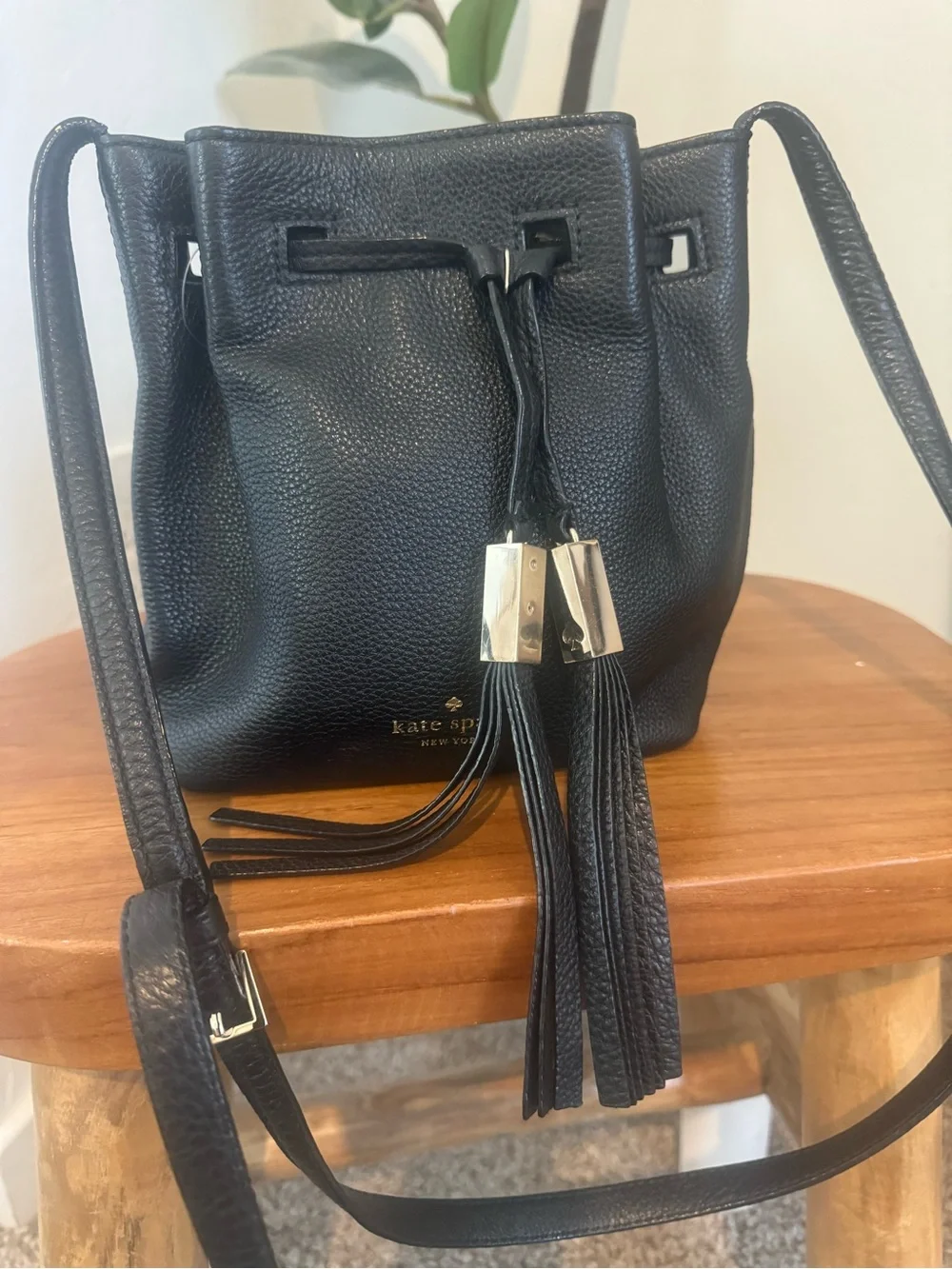 kate spade black pebbled leather tassel drawstring crossbody bag